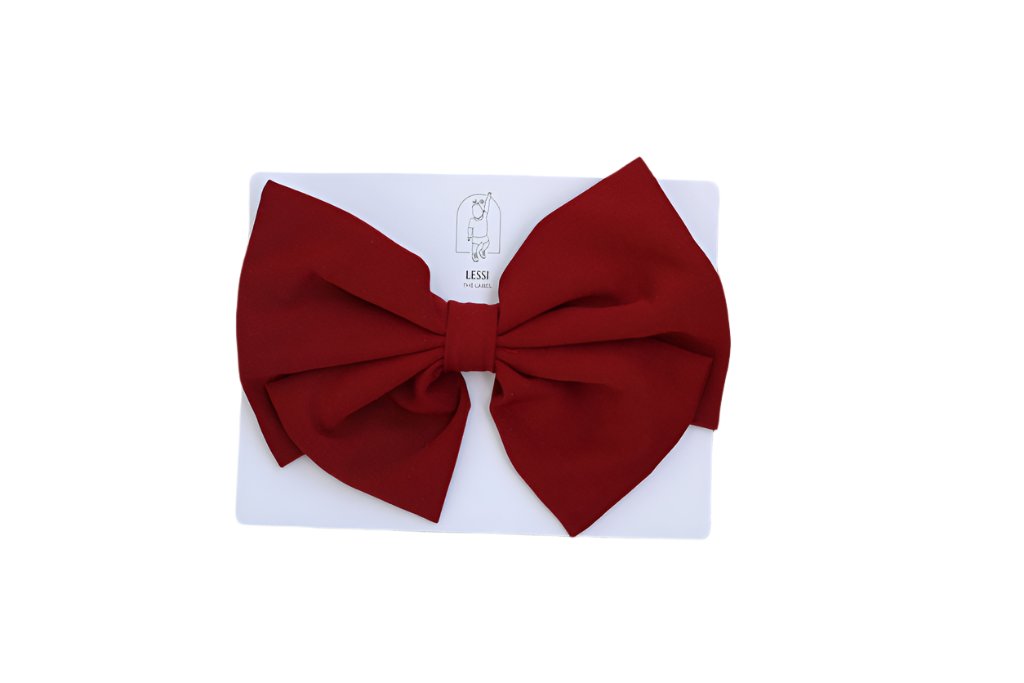 Discover the Alessia Bow in Rosso, a signature piece by Lessi the Label. Crafted for elegance, this extra-large bow makes your little one feel like royalty. Available in multiple colors to complement any style. Enjoy worldwide shipping and 10% off your first order!