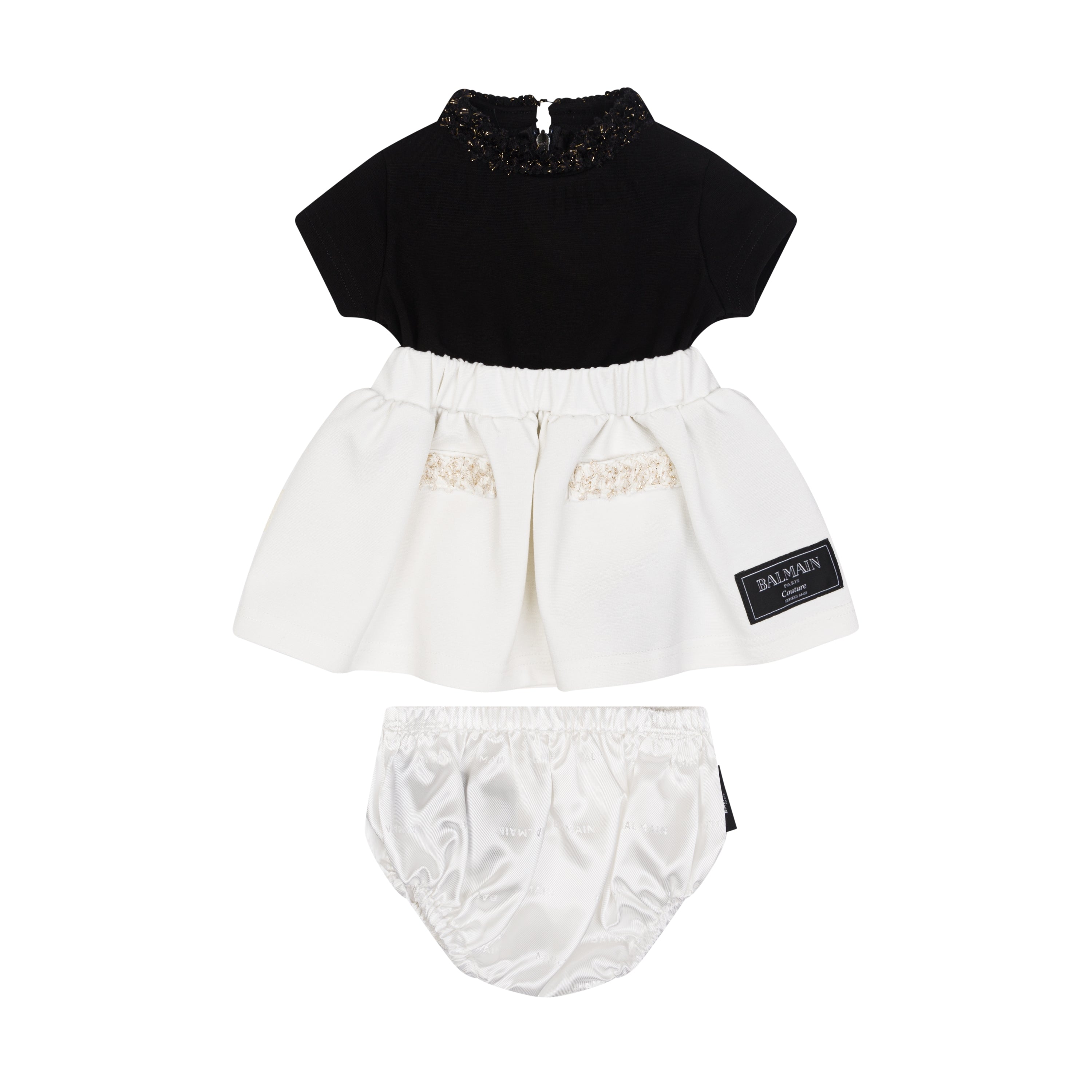 Black top and white skirt with bloomers set on a white background