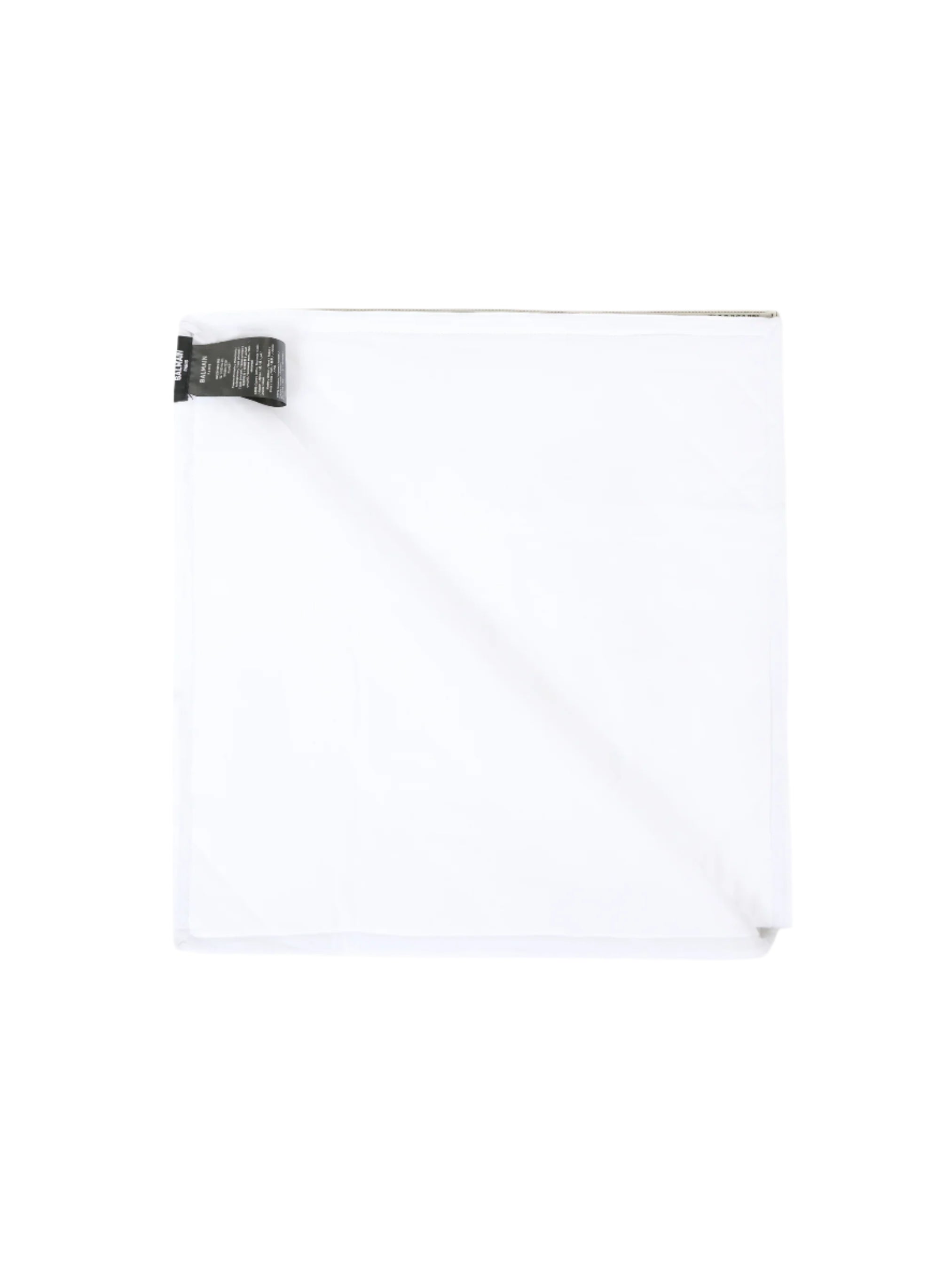 White shirt with a black tag on a white background