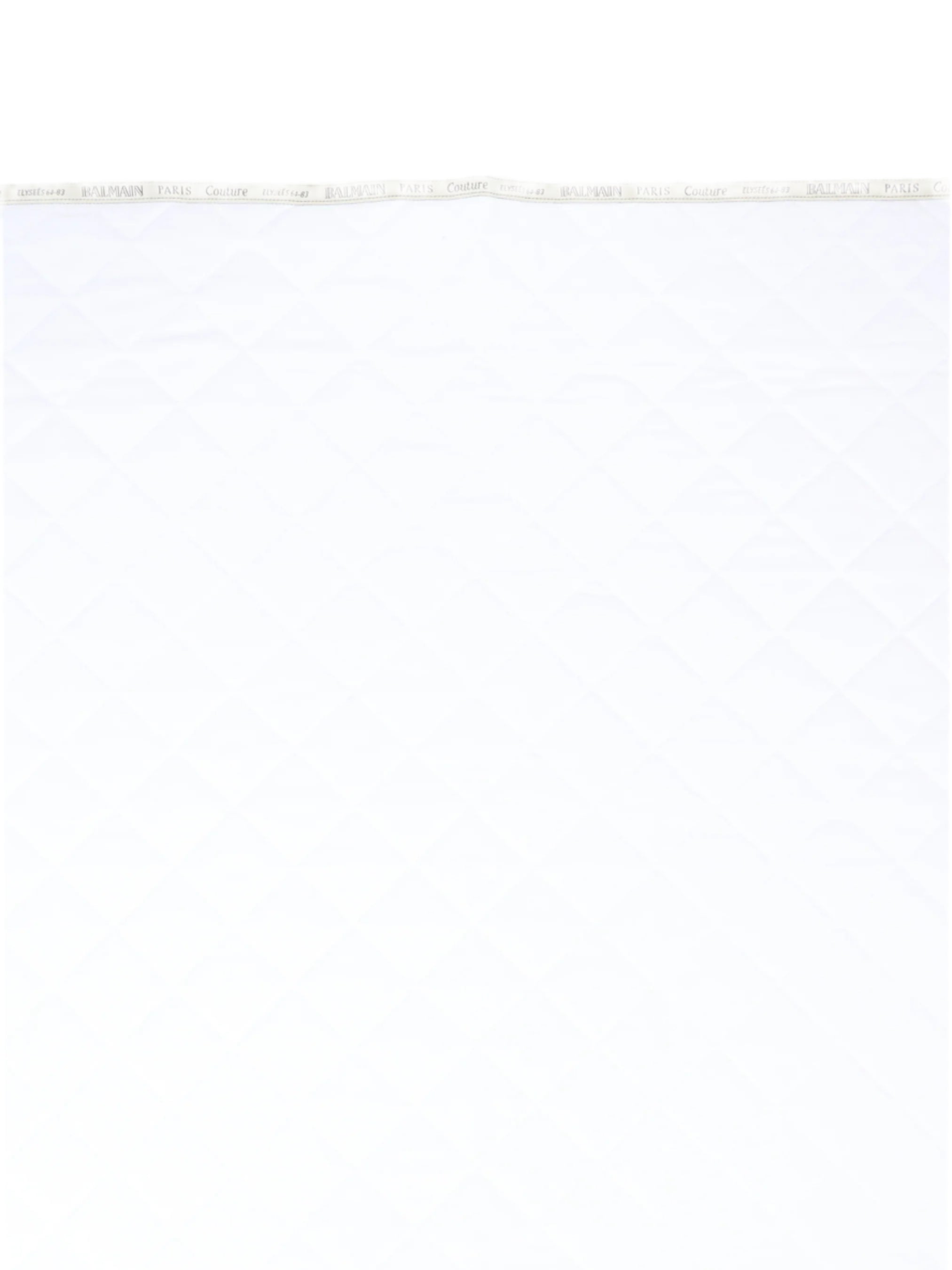 White fabric with Balmain branding on a white background