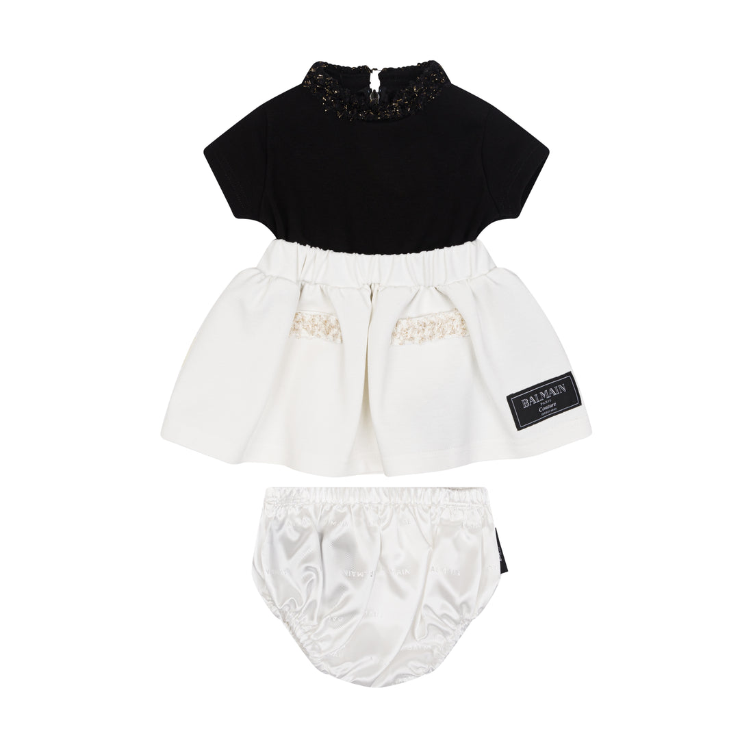 Black top and white skirt with bloomers set on a white background