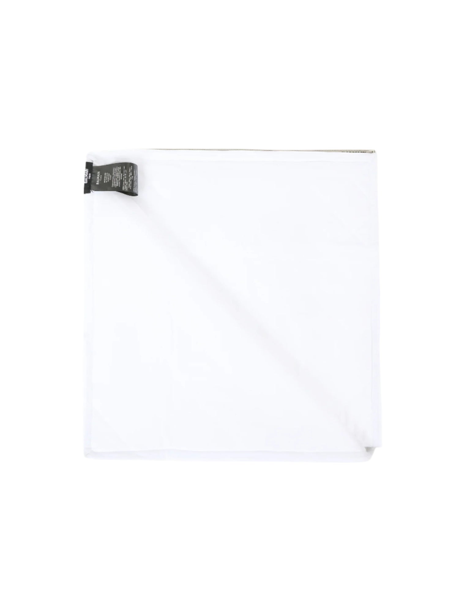 White shirt with a black tag on a white background