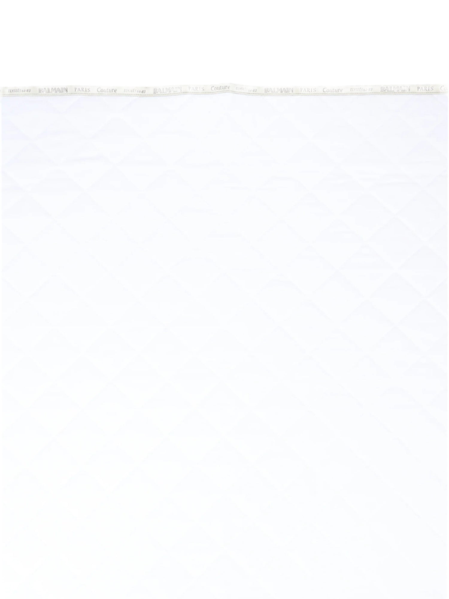 White fabric with Balmain branding on a white background